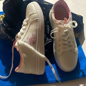Brand new never been worn white sneakers. Pink inner interior flowers on sides.